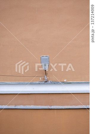 modern street lamp on the background of a beige building.  137214009