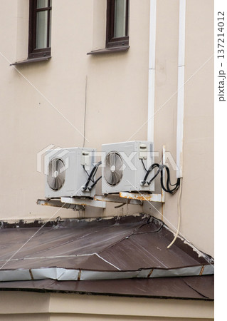 air conditioning on facade of building, air cooling in hot weather.  137214012