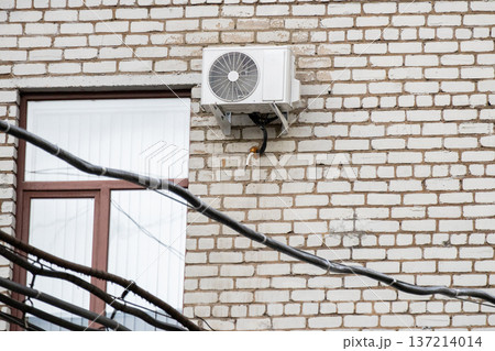air conditioning on facade of building, air cooling in hot weather. air conditioning on facade of building, air cooling in hot weather. 137214014