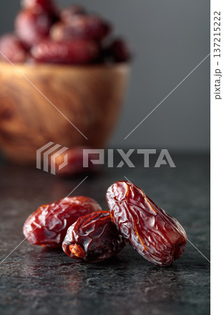 Dried dates fruit on a black table. 137215222