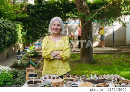 Teacher during outdoor sustainable education, lesson in forest school. 137215662