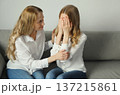 Upset offended caucasian two women, mature mother or sister and adult daughter together at home 137215861