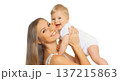 Happy cheerful smiling mother holding baby, joyful young mom and little child on white background 137215863