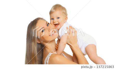 Happy cheerful smiling mother holding baby, joyful young mom and little child on white background Happy cheerful smiling mother holding baby, joyful young mom and little child on white background 137215863