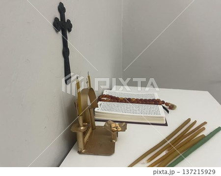 open bible, candles and rosary in the home altar 137215929
