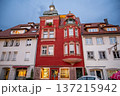 Wangen, germany, august 17, 2023. Historic red building featuring an ornate facade, bay windows, and a small turret against a blue sky at dusk in wangen im allgau 137215942