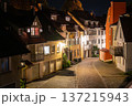 Wangen, germany, august 17, 2023. Wangen im allgau old town street winding between traditional houses with illuminated windows and a cobblestone road at night 137215943