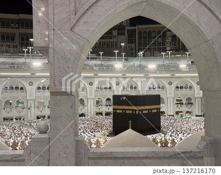 Pilgrims circling the Kaaba at Masjid al-Haram in Mecca during night worship and Tawaf Pilgrims circling the Kaaba at Masjid al-Haram in Mecca during night worship and Tawaf 137216170