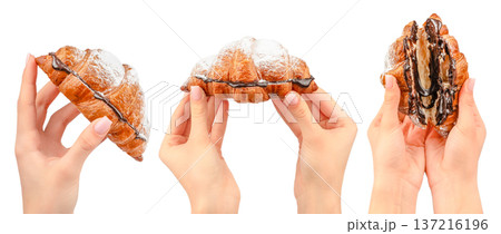 Chocolate Filled Croissant in Female Hands Isolated on White Chocolate Filled Croissant in Female Hands Isolated on White 137216196