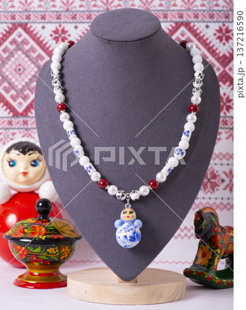 Russian symbols matryoshka, balalaika, rubles cash and flag of russian federation on wooden background. Russian symbols matryoshka, balalaika, rubles cash and flag of russian federation on wooden background. 137216590
