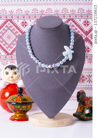 Russian symbols matryoshka, balalaika, rubles cash and flag of russian federation on wooden background. Russian symbols matryoshka, balalaika, rubles cash and flag of russian federation on wooden background. 137216615