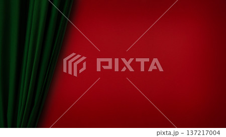 Green velvet curtain against red textured wall with copy space 137217004