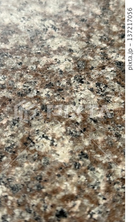 Granite texture with a mix of brown, black, and white speckles, suitable for background use Granite texture with a mix of brown, black, and white speckles, suitable for background use 137217056