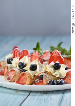 French crepes with cream and berries French crepes with cream and berries 137217165