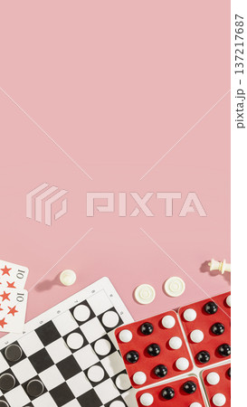 Board Games Flat Lay With Checkers, Dominoes And Playing Cards On Pink Background Board Games Flat Lay With Checkers, Dominoes And Playing Cards On Pink Background 137217687