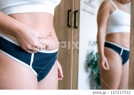 Overweight woman. Female body touching belly. Body positivity co Overweight woman. Female body touching belly. Body positivity co 137217722