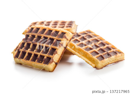 Sweet waffles with chocolate isolated on white background. Sweet waffles with chocolate isolated on white background. 137217965