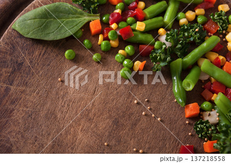 Healthy food, vegetarian nutrition. Organic vegetable mix on wooden table, close-up. Diet eating Healthy food, vegetarian nutrition. Organic vegetable mix on wooden table, close-up. Diet eating 137218558