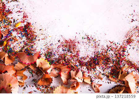 Wooden colored pencil sharpening shavings frame on white isolated background, top view, flat lay, copy space Wooden colored pencil sharpening shavings frame on white isolated background, top view, flat lay, copy space 137218559