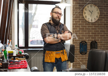 Barber is waiting for client. Professional hairstylist in male barbershop 137218830