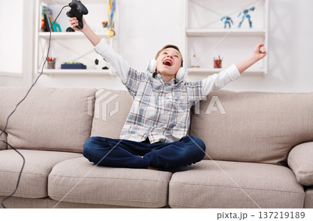 Win video game. Play online, technology for teens concept Win video game. Play online, technology for teens concept 137219189