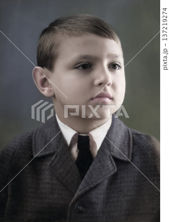 A vintage portrait of a stylishly dressed handsome boy in a suit and tie. Retro photo from 1966. A vintage portrait of a stylishly dressed handsome boy in a suit and tie. Retro photo from 1966. 137219274