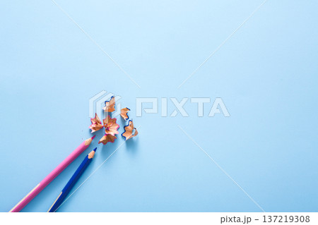 Art and education, creativity background. Color pencil shavings on blue, flat lay, copy space, top view Art and education, creativity background. Color pencil shavings on blue, flat lay, copy space, top view 137219308