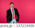 Confident young person wearing suit and red tie 137219406