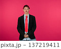 Young person expressing individuality in business casual attire 137219411