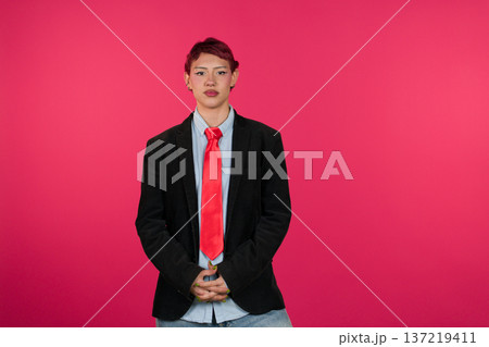 Young person expressing individuality in business casual attire 137219411