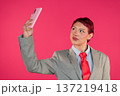 Stylish person taking personal selfie with smartphone 137219418