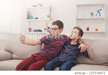 Selfie with friend, children teenagers make mobile photo at home 137219871