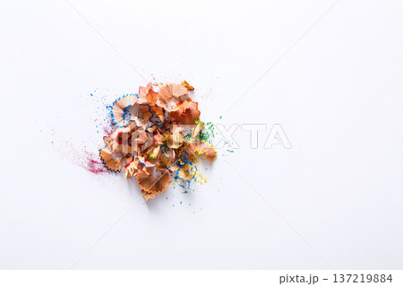 Wooden colored pencil sharpening shavings pile on white isolated background, top view, flat lay, copy space Wooden colored pencil sharpening shavings pile on white isolated background, top view, flat lay, copy space 137219884