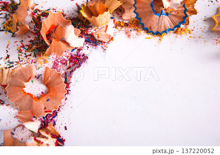 Wooden colorful pencil sharpening shavings, on white isolated background, top view, flat lay, copy space Wooden colorful pencil sharpening shavings, on white isolated background, top view, flat lay, copy space 137220052