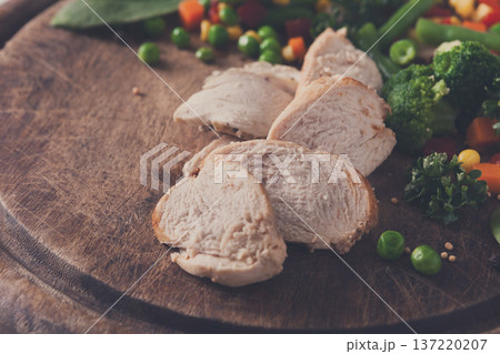 Healthy food, diet nutrition. Turkey and vegetable mix on wooden table, close-up. 137220207