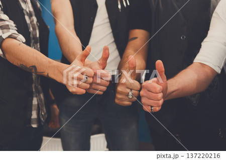 Young male team show thumb up sign. Like gesture from stylish men, hands closeup Young male team show thumb up sign. Like gesture from stylish men, hands closeup 137220216