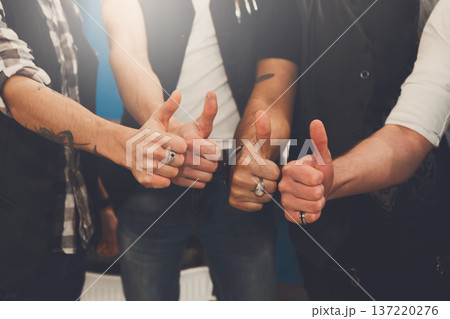 Young male team show thumb up sign. Like gesture from stylish men, hands closeup 137220276
