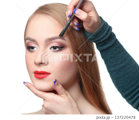 Eyebrow shadow applying, brow modelling makeup closeup. Female model face with fashion make-up, beauty concept isolated Eyebrow shadow applying, brow modelling makeup closeup. Female model face with fashion make-up, beauty concept isolated 137220478