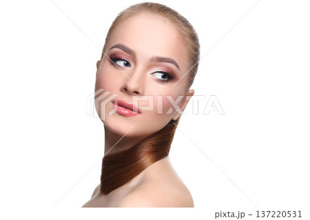 Beauty model isolated on white background, fashion shooting. Woman with makeup, perfect skin and hair posing to camera at studio Beauty model isolated on white background, fashion shooting. Woman with makeup, perfect skin and hair posing to camera at studio 137220531