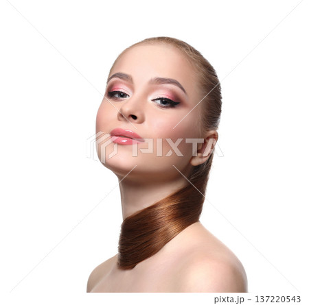 Beauty model isolated on white background, fashion shooting. Woman with makeup, perfect skin and hair posing to camera at studio Beauty model isolated on white background, fashion shooting. Woman with makeup, perfect skin and hair posing to camera at studio 137220543