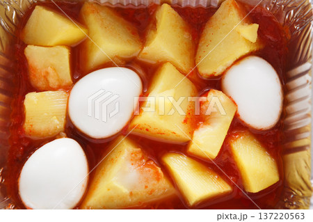 Healthy lunch in foil container. Healthy food take away and delivery. Potatoes with tomato paste, eggs, closeup Healthy lunch in foil container. Healthy food take away and delivery. Potatoes with tomato paste, eggs, closeup 137220563