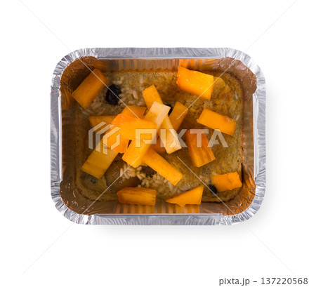 Healthy lunch in foil container. Healthy food take away and delivery. Pumpkin with rice in box on white background, closeup, isolated Healthy lunch in foil container. Healthy food take away and delivery. Pumpkin with rice in box on white background, closeup, isolated 137220568