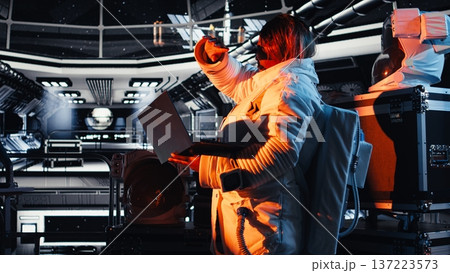 Astronaut blinded by light coming from alien vessel while navigating orbital trajectory. Cosmonaut exploring planetary surfaces making contact with extraterrestrial presence Astronaut blinded by light coming from alien vessel while navigating orbital trajectory. Cosmonaut exploring planetary surfaces making contact with extraterrestrial presence 137223573
