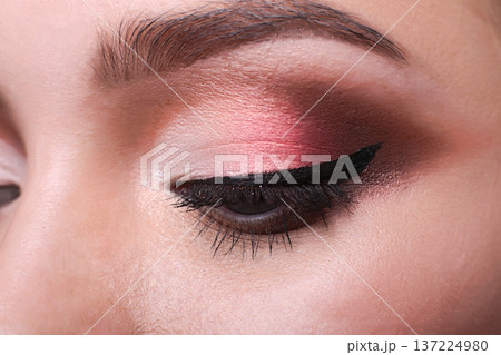 Beautiful eye makeup closeup. Female model face with fashion make-up, beauty concept isolated 137224980