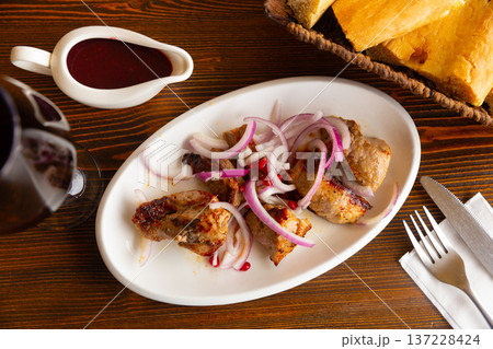 Grilled pork meat shashlik with sliced onion Grilled pork meat shashlik with sliced onion 137228424