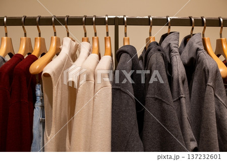 Pairs of clothes on hangers. Two identical items in wardrobe. Buying favorite items twice. Wardrobe with a set of each item. Conveniently buying two items at once. Pairs of clothes in closet Pairs of clothes on hangers. Two identical items in wardrobe. Buying favorite items twice. Wardrobe with a set of each item. Conveniently buying two items at once. Pairs of clothes in closet 137232601