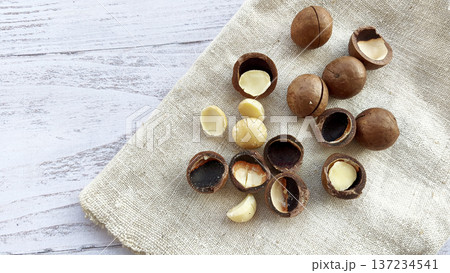 Macadamia nuts with a cutout on a canvas napkin. Healthy organic food 137234541