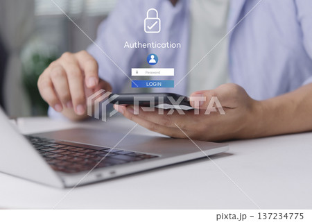 User secure login authentication password. Cybersecurity concept data protection. Man hand using smartphone laptop desk. Virtual screen padlock icon internet technology privacy. User secure login authentication password. Cybersecurity concept data protection. Man hand using smartphone laptop desk. Virtual screen padlock icon internet technology privacy. 137234775