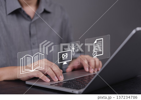 Man hand using laptop for e-learning, online education. Virtual interface icon workflow: knowledge book, webinar course, get certificate. Skill development, employee training, qualification concept. Man hand using laptop for e-learning, online education. Virtual interface icon workflow: knowledge book, webinar course, get certificate. Skill development, employee training, qualification concept. 137234786