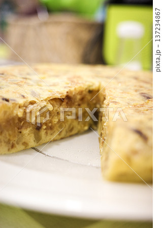Spanish potato omelette slice close up on white plate Spanish potato omelette slice close up on white plate 137234867
